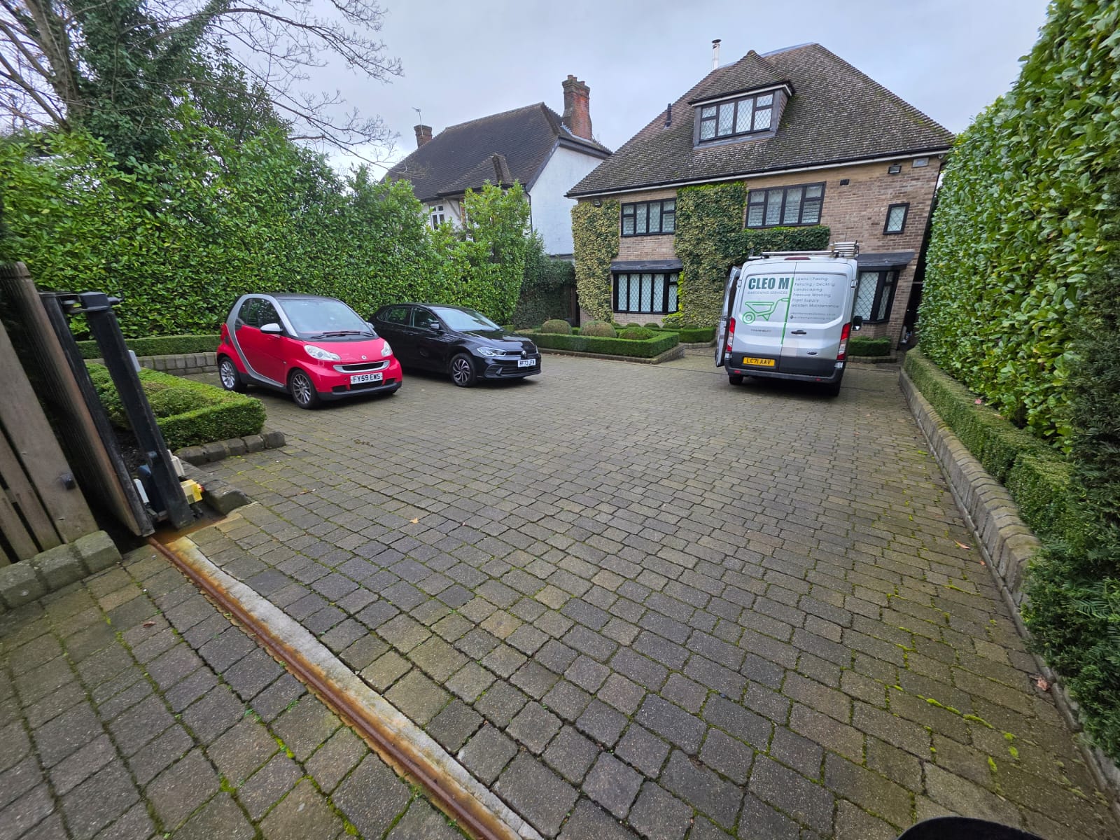 Driveway before pressure washing