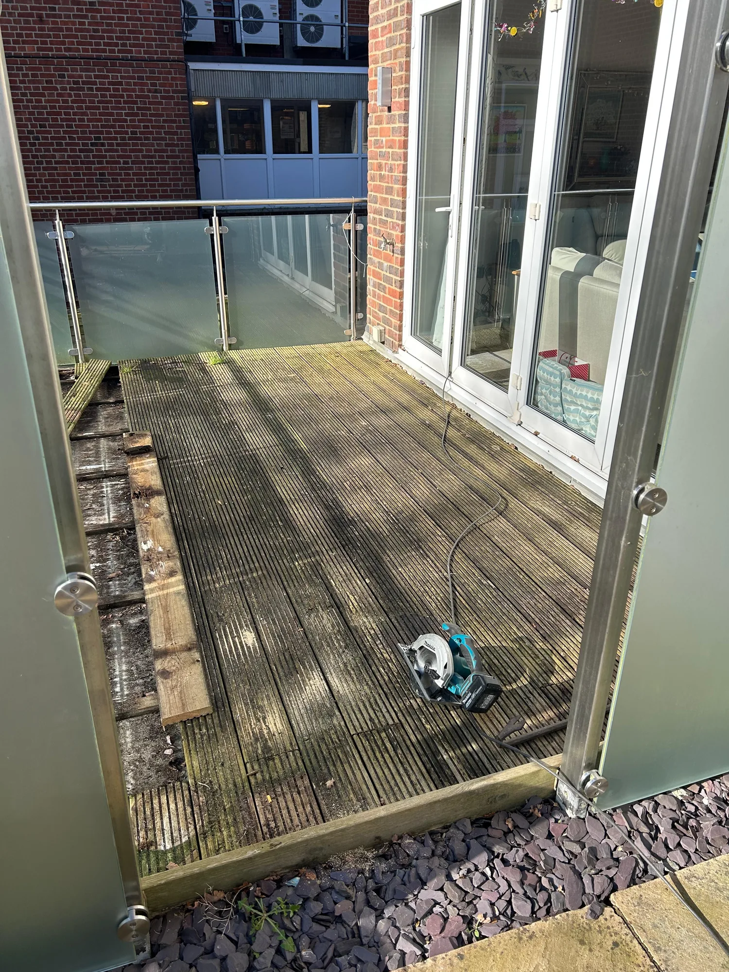 During: stripping the old rotted timber decking boards